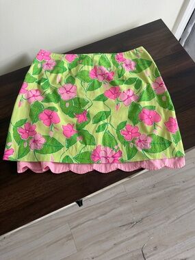 Lilly Pulitzer Pink Floral Mini Skirt on Lime Background